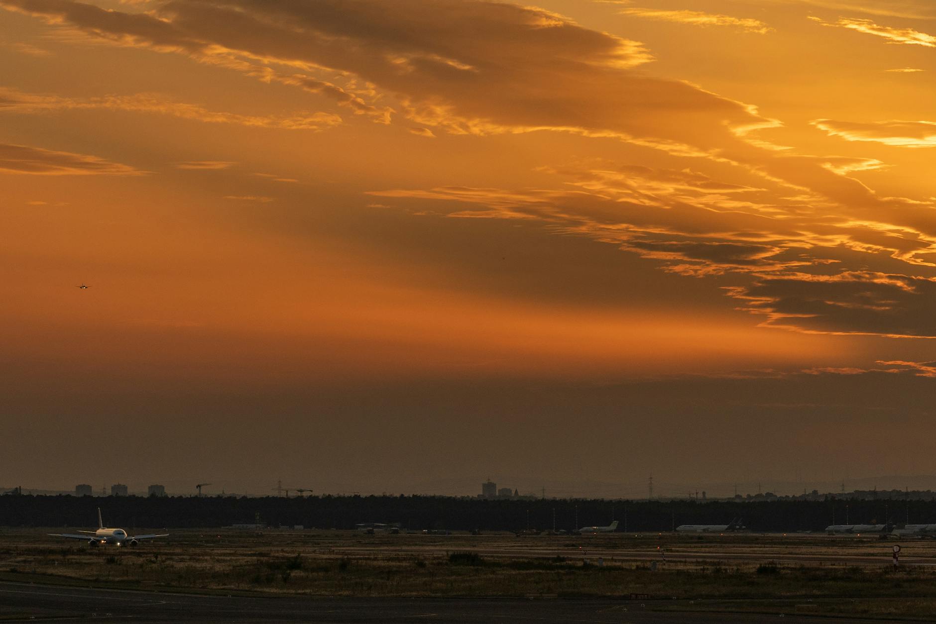 Captivating view of an airplane on the runway during a golden sunset, highlighting the beauty of aviation.