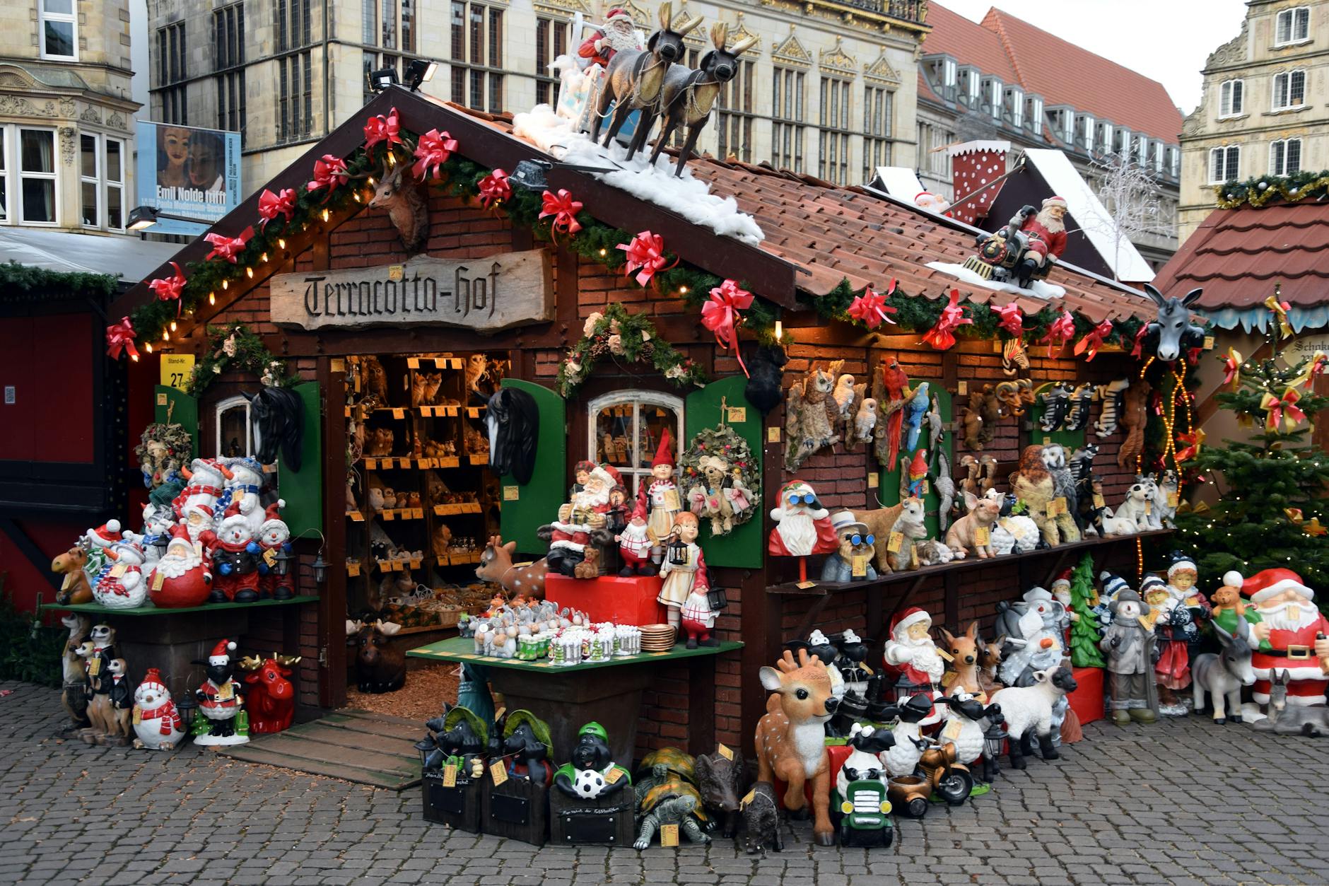 Festive Christmas market stall with colorful decorations in Bremen, Germany.