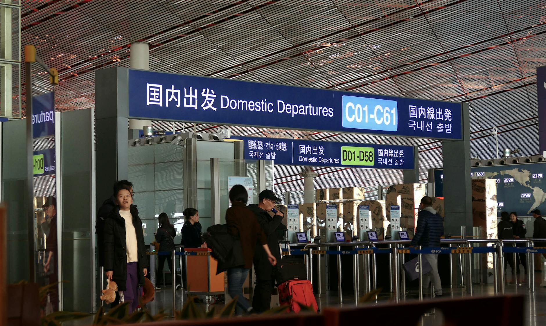 People moving through the domestic departures terminal at Beijing airport.
