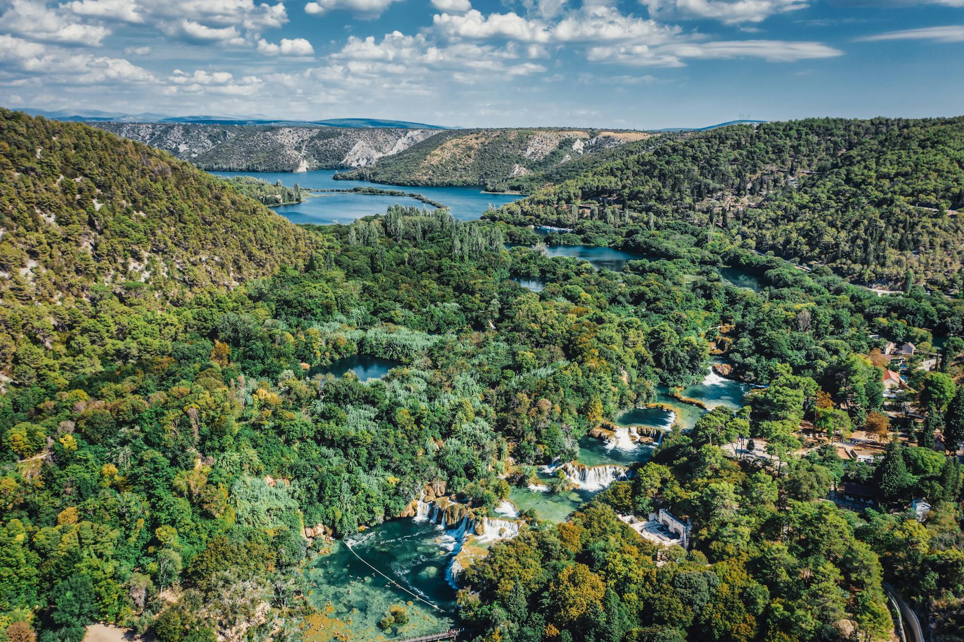 A breathtaking aerial view of lush greenery and waterfalls in Krka National Park, Croatia.