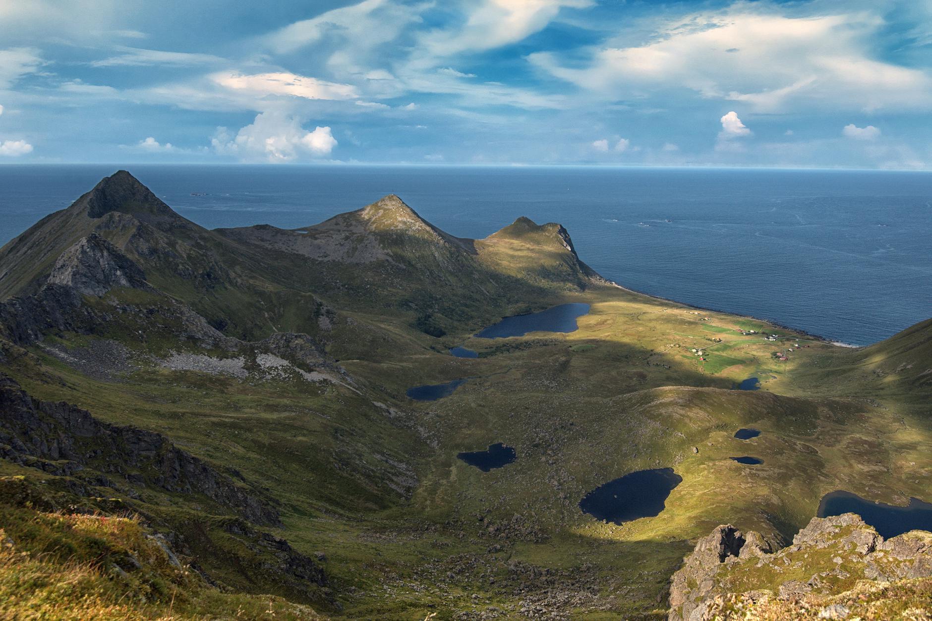 Discover the breathtaking landscapes of the Lofoten Archipelago with its majestic mountains and serene lakes.